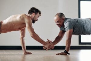 Strength training for men over 40 focusing on proper form and joint safety at Impact Fitness Solutions